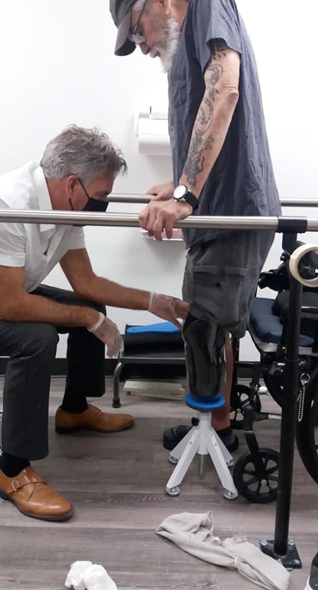 Barry Barnett learns how to walk with a prosthetic leg.